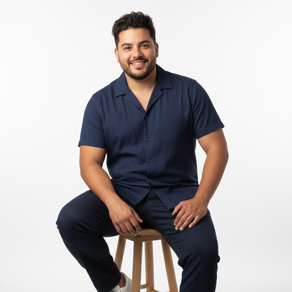 curve latino man sitting pose studio 27160985